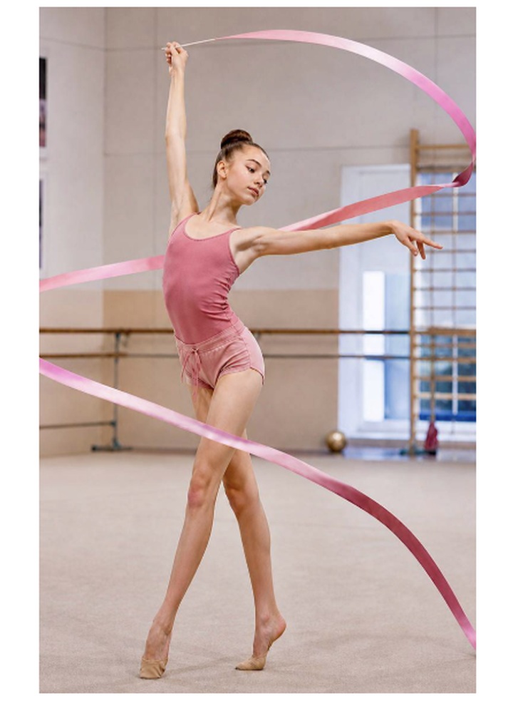 Rhythmic gymnast practicing with ribbon